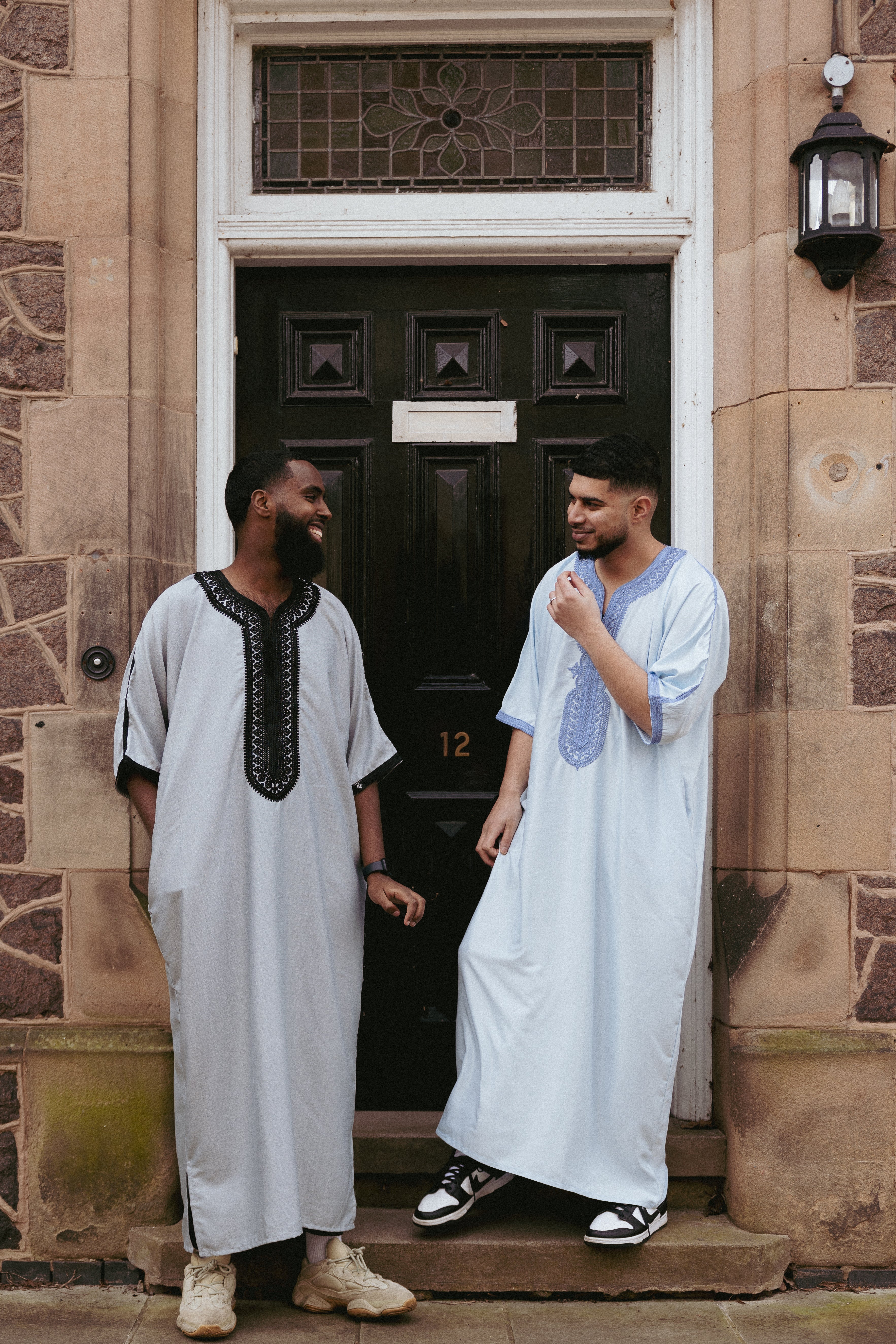 two muslims wearing moroccan thobes for men 